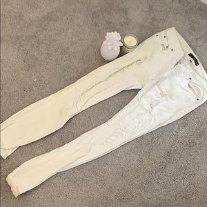 Distressed white jeans
